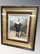 An antiquarian lithographic print of a boy in decorative gilt and velvet frame,