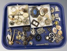 A collection of costume brooches including marcasite and paste examples.