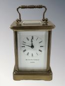 A brass carriage timepiece signed Matthew Norman London,