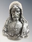 An ebonised plaster bust of Christ,