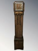 An Art Deco oak granddaughter clock, height 138 cm.