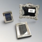 Three silver mounted photo frames, tallest 10 cm.