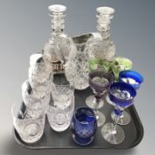 A pair of 19th century cut crystal mallet decanters and stoppers upon EPNS bottle coasters,