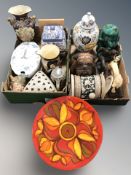 A carved wooden figure of a dog, further resin animal figures, pottery vases and storage jars,