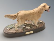 A Royal Doulton figure of a retriever, width 29 cm.