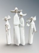 A Lladro figure group of two nuns, No. 4611 and two other similar figures No. 5550 and 5551.