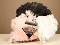 A group of ostrich feather fans and a further faux tortoise shell sequined fan.