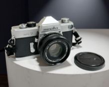 A Minolta SR-7 35mm film camera with MC Rokkor-PF 1:2 f=50mm lens.