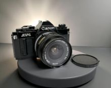 A Canon AV-1 35mm film camera, with Canon FD 28mm 1:2.8 S.C.