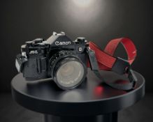 A Canon A-1 35mm film camera, with Canon FD 50mm 1:1.