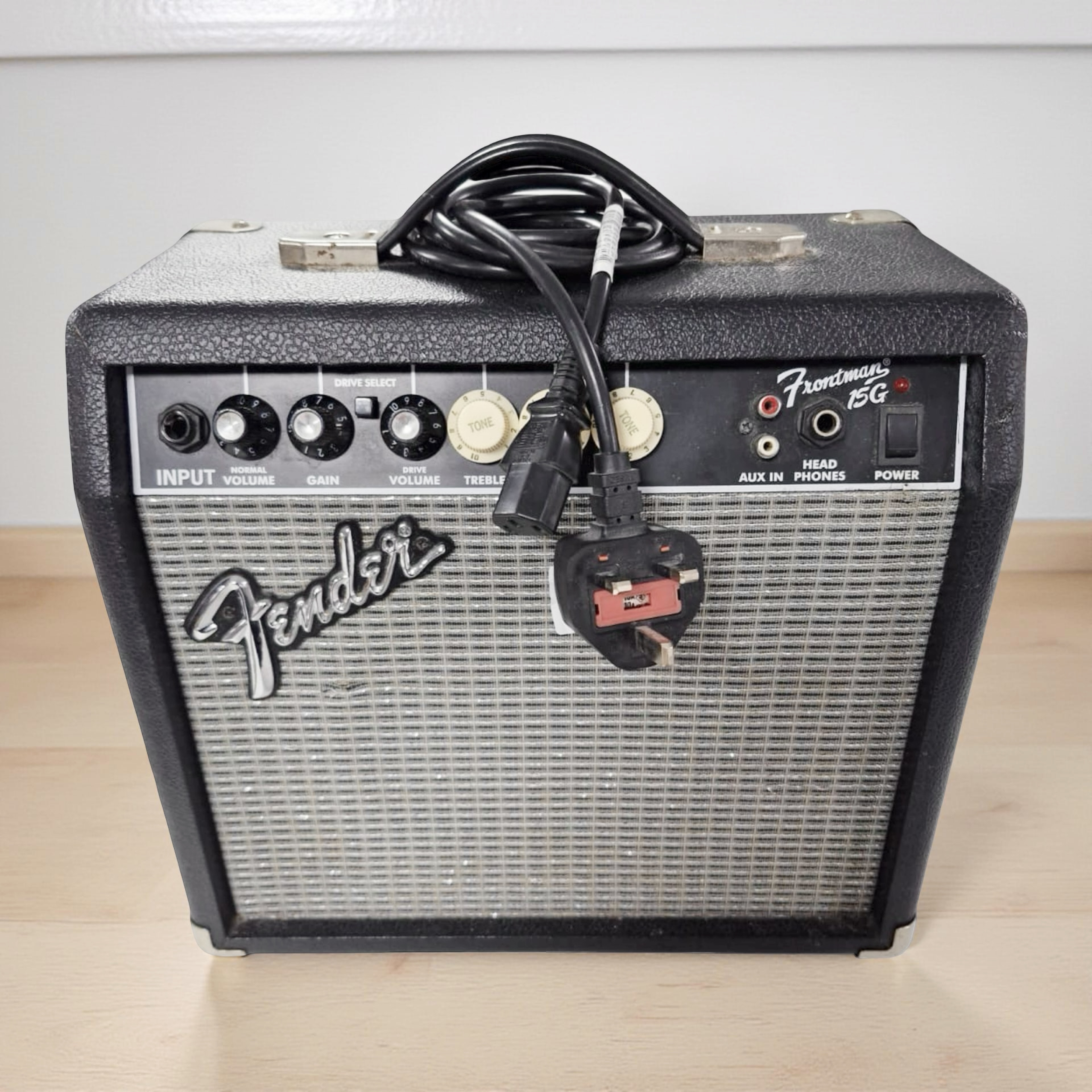 A Fender Frontman 15G amplifier with lead.