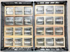 A set of eight wooden chests containing three glass drawers