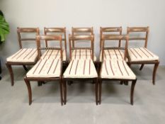 A good quality set of eight Regency-style carved rosewood and brass-inlaid dining/occasional chairs,
