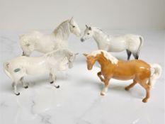 Four Beswick figures : 'Shire Mare', model 818, height 21 cm, together with three further horses,