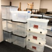 Nine plastic storage boxes with lids,