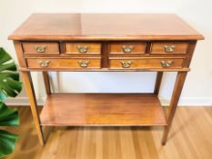 A reproduction mahogany and satin wood inlaid six drawer side table,