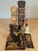 A group of ethnic carvings, statues and masks.