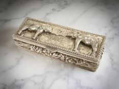 A small Indian white metal hinged box depicting elephants, width 6.25cm.
