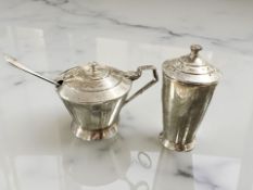 A silver mustard pot, with associated caddy spoon, and a sifter.