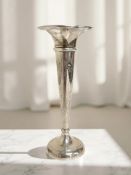 A loaded silver bud vase,