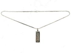A Britannia silver ingot pendant on chain, length 4cm,