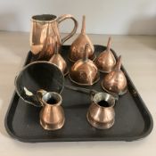 A group of 19th century copper measures and funnels.