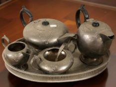 A silver-plate four piece tea service and a gallery tray.