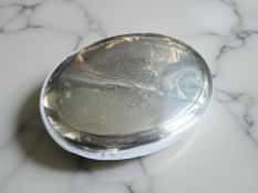 An Edwardian silver oval snuff box, engraved with initials IS, Chester 1907, width 8.75cm.