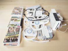 A Nintendo Wii console, controllers and various games.