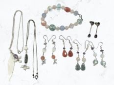 Several pairs of silver earrings set with coloured quartz, amethyst and other faceted stones,