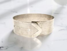 A silver bangle in the form of a belt, London 1946 CONDITION REPORT: 38.