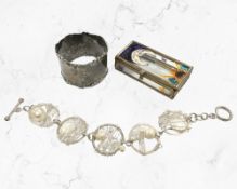 A silver napkin ring, a pearl bracelet stamped 925, and a small glazed trinket box.
