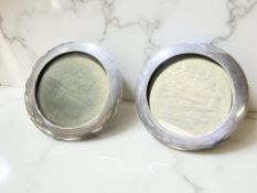 A pair of silver circular photograph frames, Chester and Birmingham marks, diameter 14 cm.