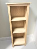 A contemporary oak effect open bookcase,