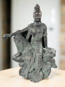An Austin Sculpture patinated metal figure of Buddha seated on a rock, height 50 cm.