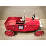 A child's tin ride-on fire chief car, length 102 cm.