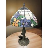 A Tiffany-style patinated metal and stained glass mushroom table lamp, height 49 cm.
