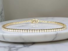 An 18ct rose gold diamond tennis bracelet, the total diamond weight estimated at 3.