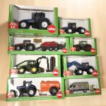 Eight Siku 1:50 and 1:32 scale die cast models, mostly tractors,
