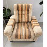 A Scandinavian 1970's lounge armchair in striped fabric,