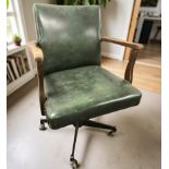 A 20th century green leather upholstered swivel desk armchair, width 61 cm.