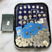 An extensive collection of fifty pence coins, two pound coins and five pound coins,