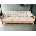 A Scandinavian pine framed settee/day bed in checked fabric,