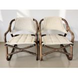 A pair of Scandinavian bentwood armchairs with slung fabric seats and back rests,