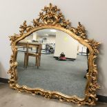 A reproduction gilt gesso overmantel mirror, 125 cm x 116 cm.
