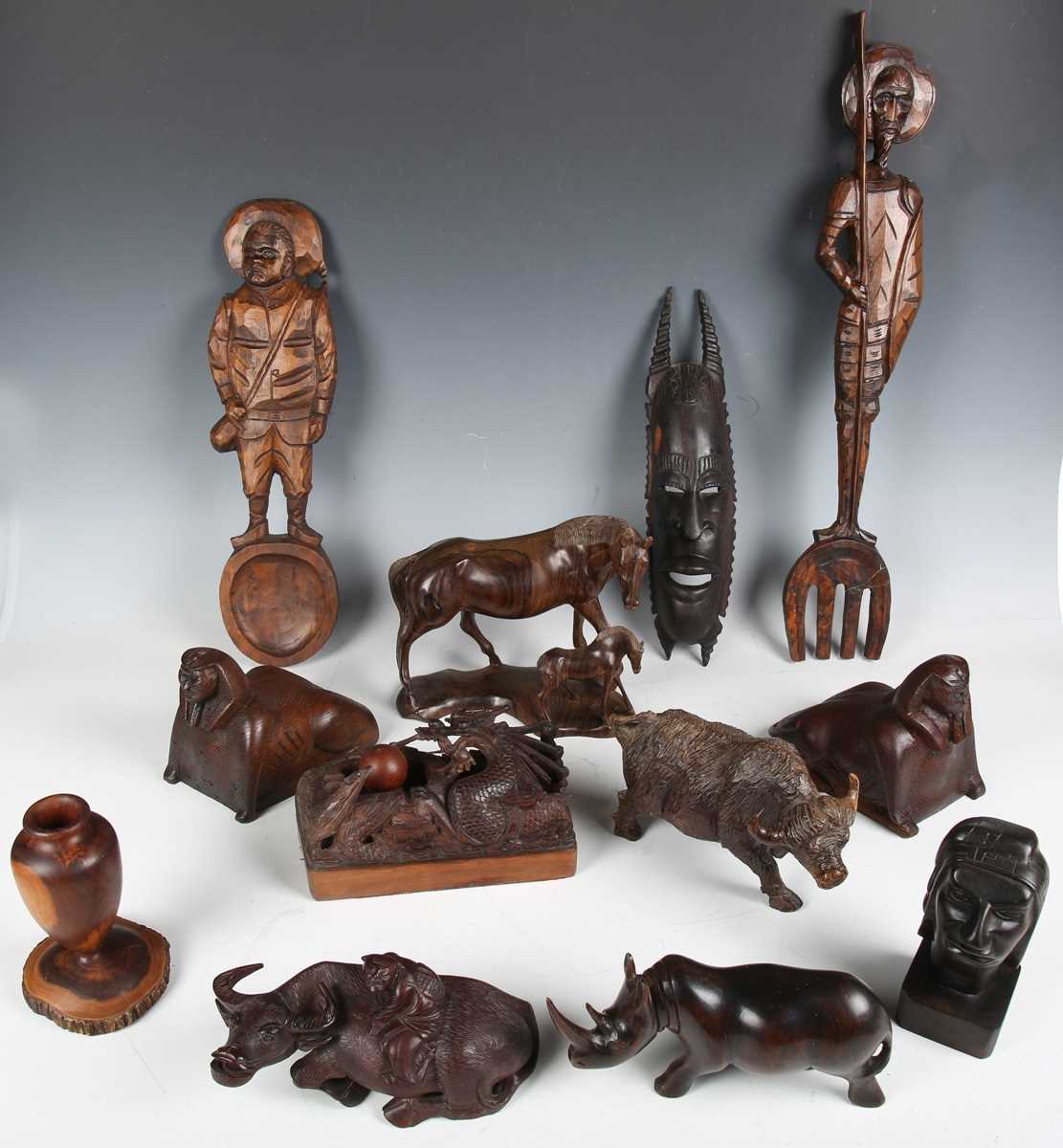 A large collection of mainly 20th century carved and turned treen, including a Chinese carved bamboo