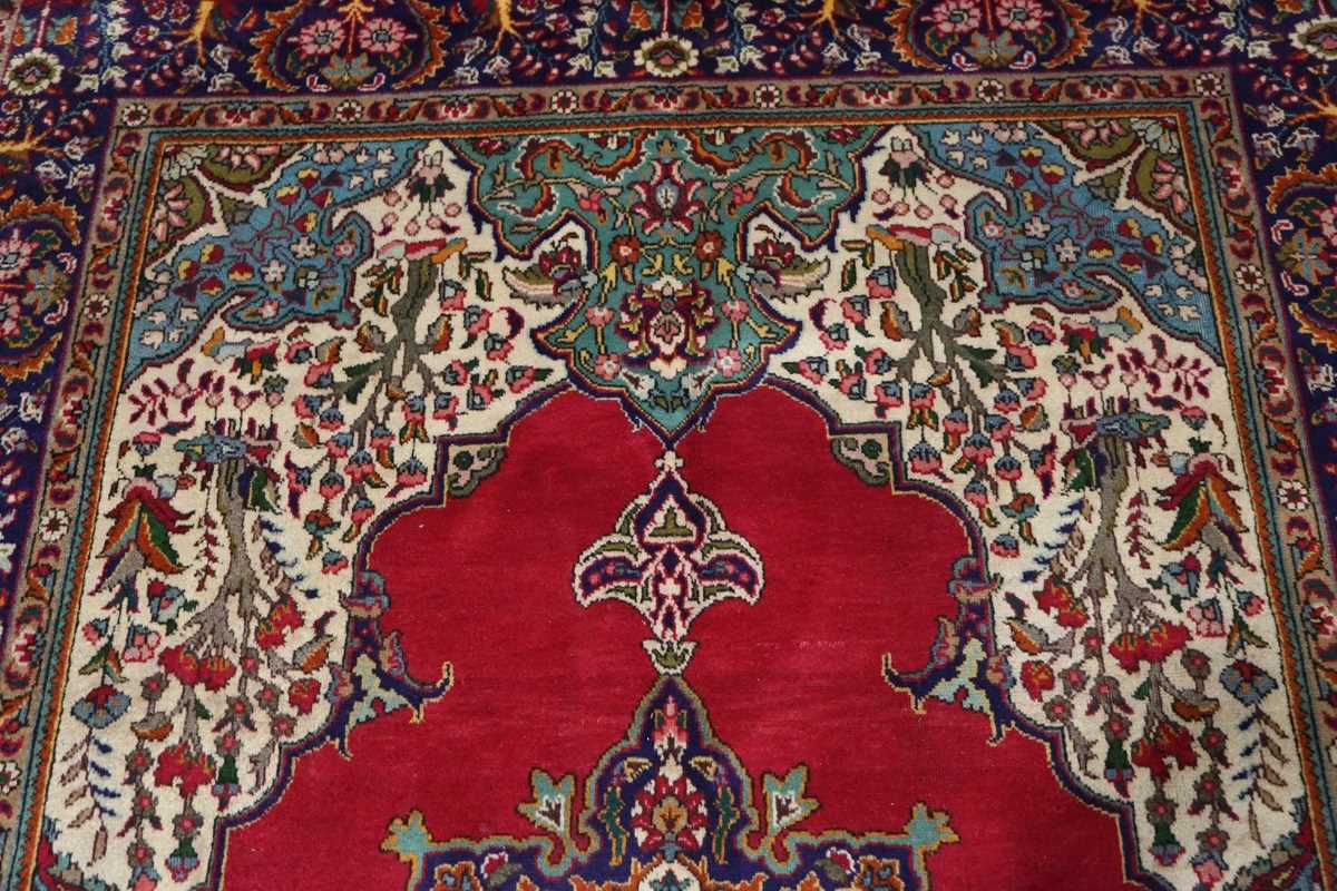 A Tabriz carpet, North-west Persia, late 20th century, the red field with a shaped medallion and - Image 4 of 8