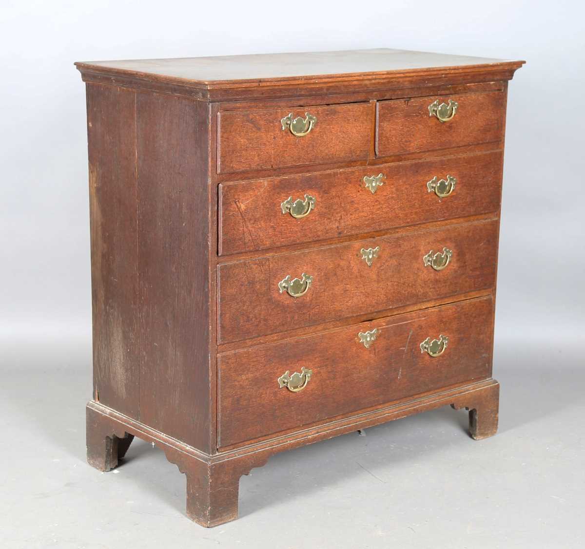 A George III provincial oak chest of drawers, height 98cm, width 98cm, depth 51cm.