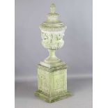 A late 20th century stone-effect composite garden urn and cover, height 172cm, width 50cm.