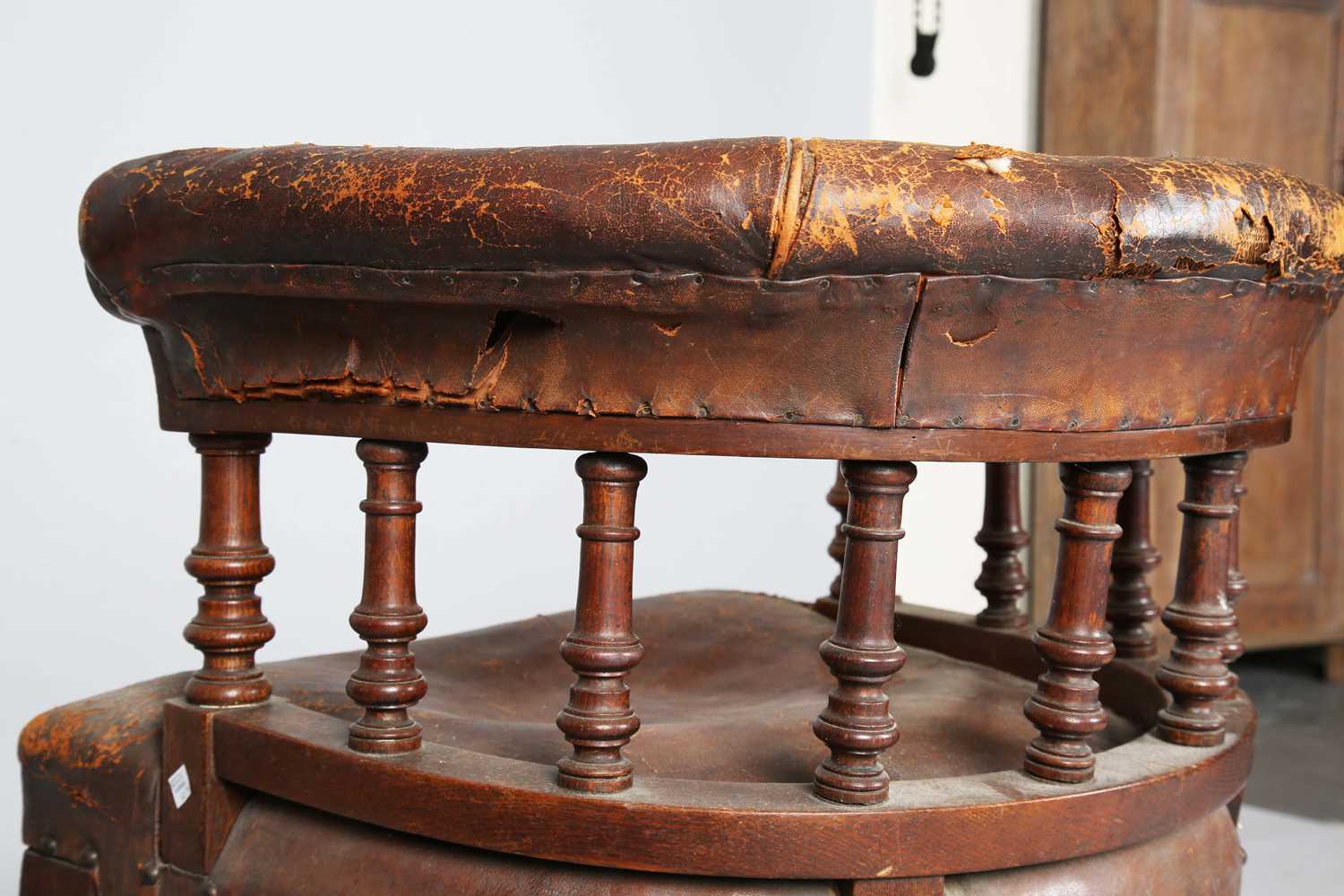 A late Victorian oak framed tub back desk chair, upholstered in brown leather, height 74cm, width - Image 11 of 11